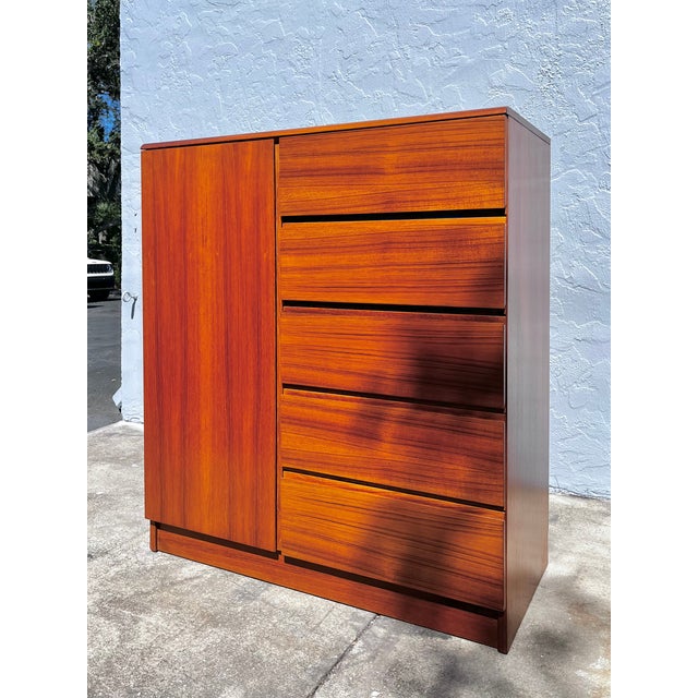 Danish mid-century modern teak highboy dresser or gentlemen’s chest. A classic Danish design with plenty of storage. Felt-...