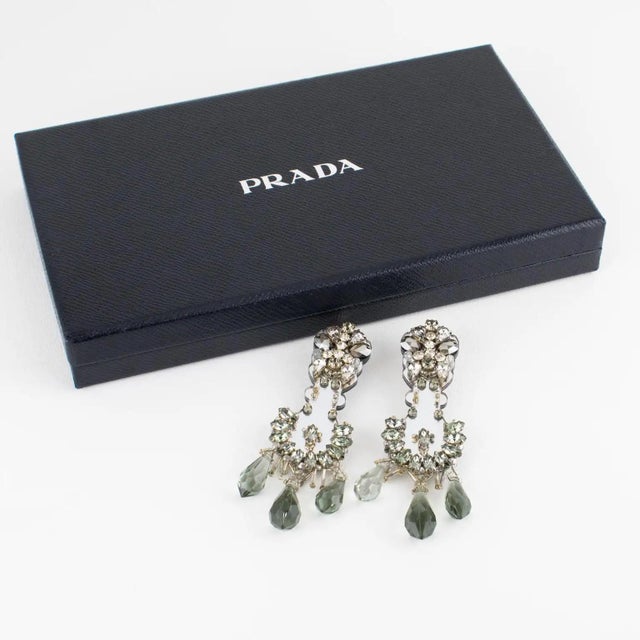 Prada Italy designed those stunning oversized dangling clip-on earrings. These bold and elegant earrings will make you...