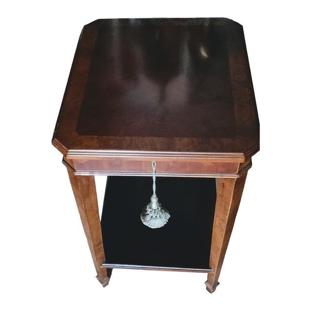 A Chippendale style octagonal side table with a slender 5" wide x 7" deep pullout tray used for drinks or for notes made...