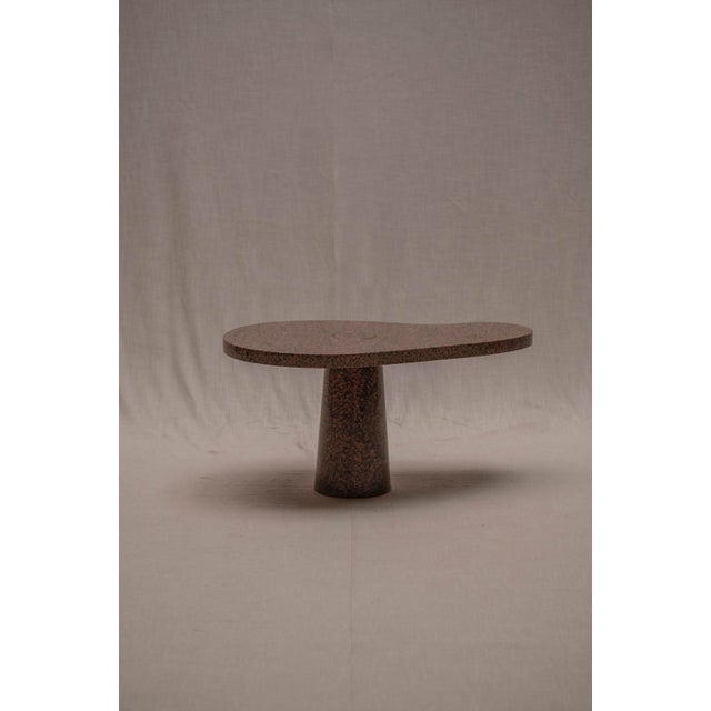 A sculptural free form side table in solid marble, dating from the 1970s–80s and attributed to Angelo Mangiarotti. The...