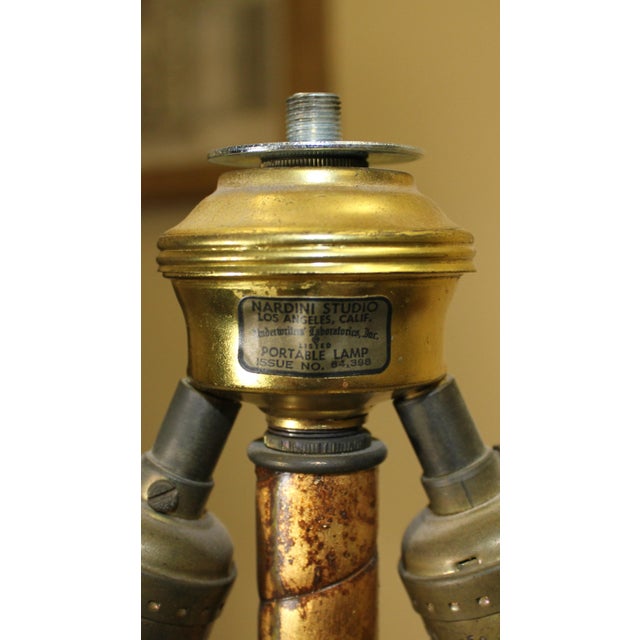 Magnificent full size floor lamp by Nardini Studios, Los Angeles, CA. Ceramic base and columns with metal floral accent...