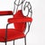 Beautiful vintage armchair in blackened iron depicting a seahorse. Upholstered in red velvet, this armchair captivates...