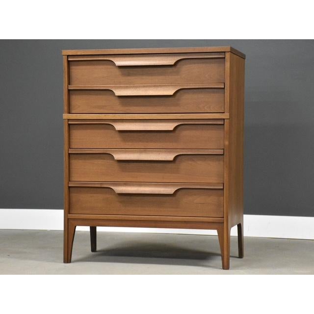A mid century walnut dresser with a scratch resistant formica top made by Johnson Carper. Circa 1960’s. Made in USA....