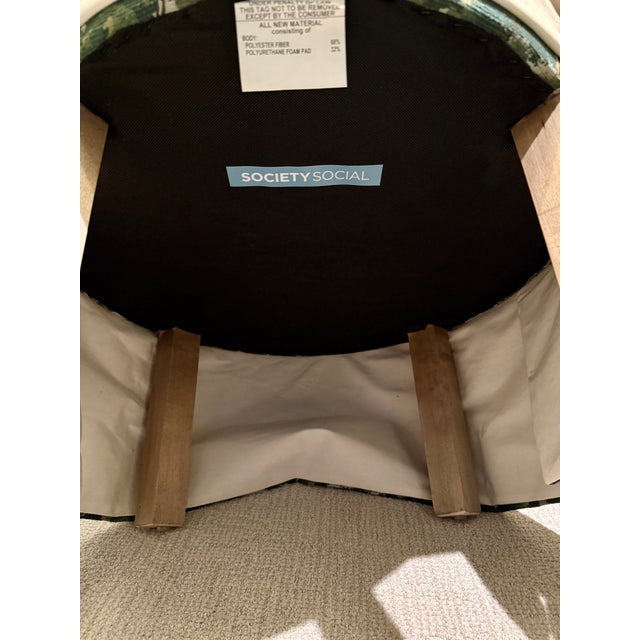 Four graceful barrel-back chairs with a silhouette and a playful design that beckons you to lounge with a cocktail in...