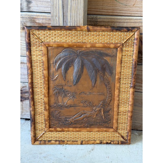Fantastic vintage Hawaiian wall art featuring an embossed copper relief scene of a reclining hula girl beneath a palm tree...
