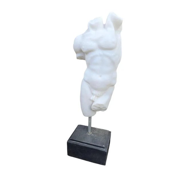 Decorative hand-carved marble sculpture representing a classical Greek male torso, crafted in Italy during the 20th...