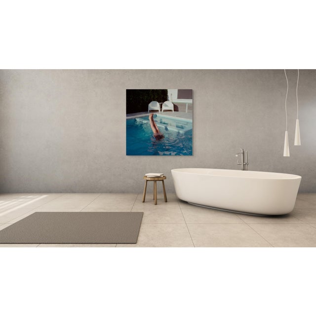 No Running on the Pool Deck by Mark Forbes captures the sunlit stillness and playful elegance of a quiet poolside moment....