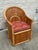 Patio lounge chair made from woven split bamboo, the back in a fan arrangement, with removable seat cushion.