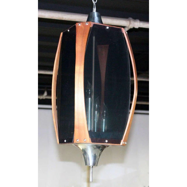 Nice vintage Danish mid century modern teak light fixture. Made in the early 20th century.