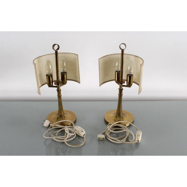 Pair of brass bedside lamp with cream fabric shades and metal base, attributed to Gaetano Sciolari, Italy, 1970s. Wear...