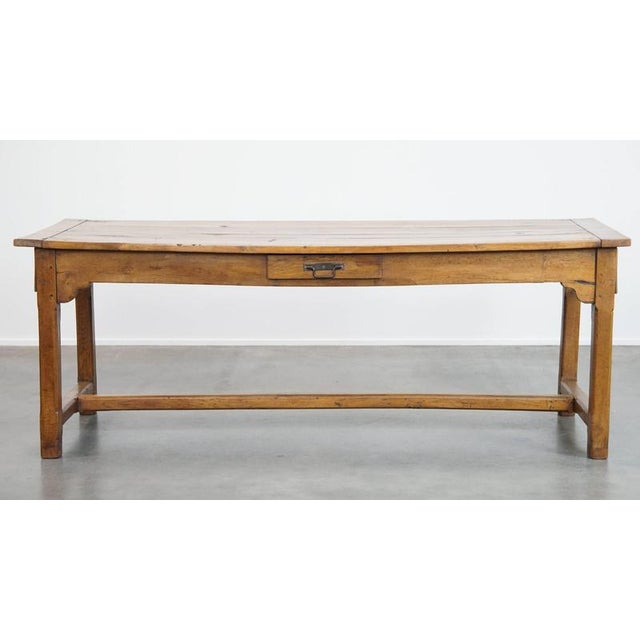 Beautiful robust antique French farmer's 6-person dining table from the end of the 18th century. A timeless addition to...