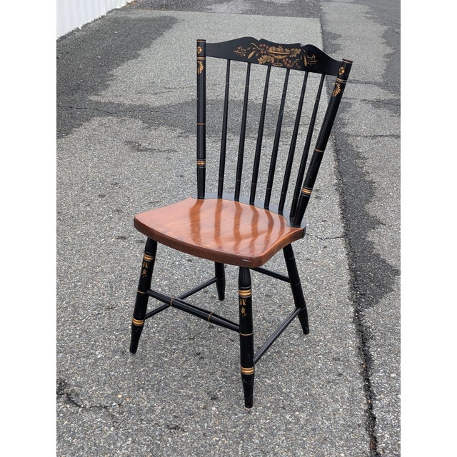 This authentic L. Hitchcock Windsor side chair is a masterful blend of New England tradition and timeless craftsmanship....