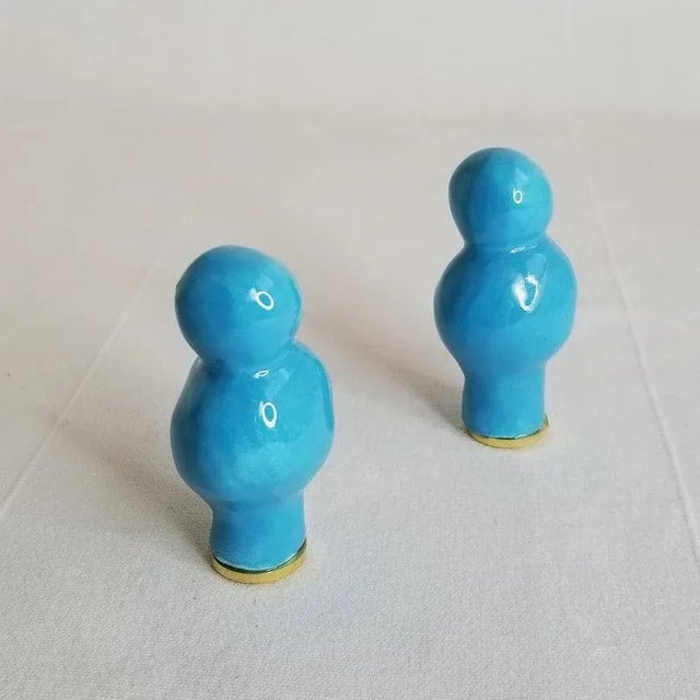 Glazed orange finials have an original, organic shape that was hand formed in clay. The look is sculpted look with a wabi-...