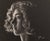 This charcoal drawing presents a striking profile of a young woman, her textured curls contrasting beautifully against a...