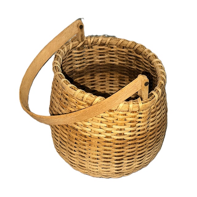 Elegant handwoven basket by Ohio artisan Mel Lapp, dated and signed 1991. Crafted in the French market style, it features...