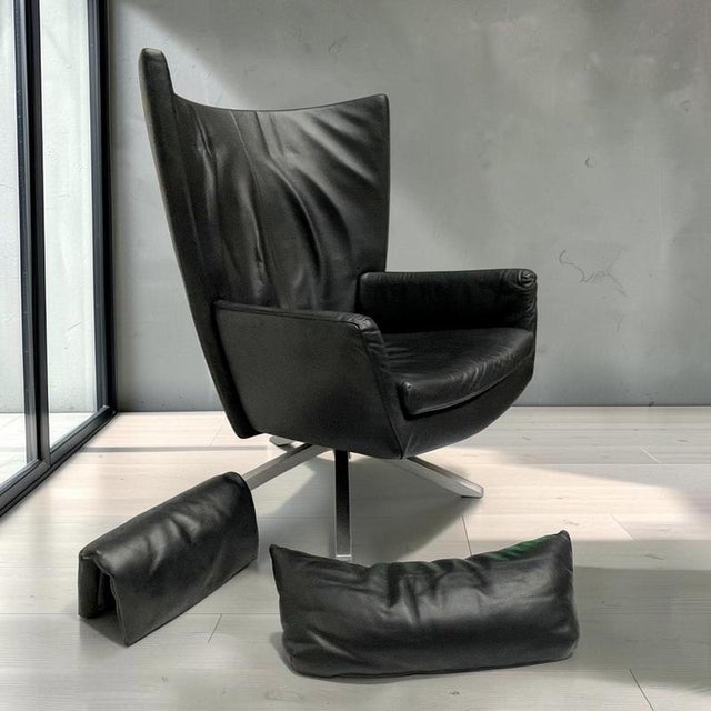 Luxury Maua swivel chair by Design On Stock. The chair is upholstered in high-quality black leather and features double...