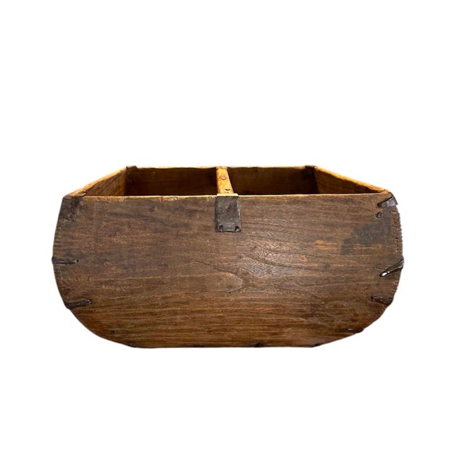 A charming, antique Chinese rice / grain bucket. Features a hand hewn wooden frame with iron strapping details. Decorated...