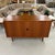 A striking record and stereo console designed by Arne Vodder for Sibast Møbler, Denmark, crafted in rich teak and bearing...