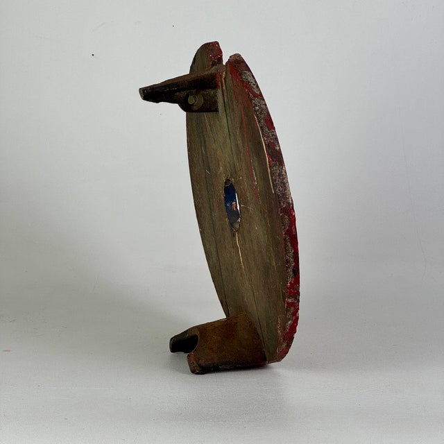 A magnificent piece of early 20th Century fairground and carnival amusement collectible. A cast iron round bullseye...