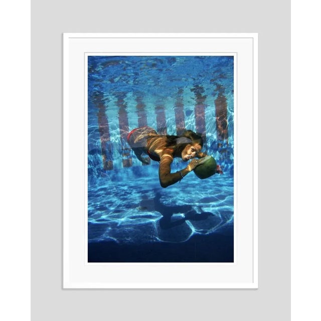 Underwater drink' by slim aarons open edition a woman drinking from a coconut underwater in the pool at las brisas hotel...