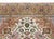 A gorgeous vintage Persian Tabriz rug with a large central floral and scrolling vine medallion living amidst a field of...