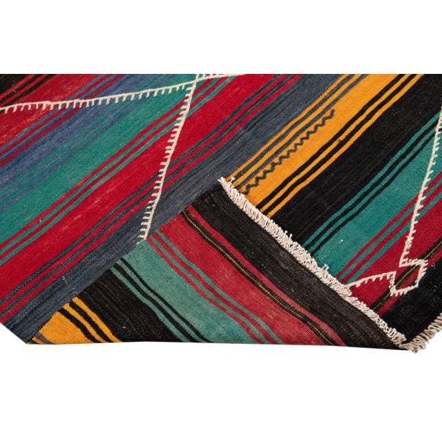 Beautiful vintage Persian Kilim hand-knotted wool runner rug with a multi-color field in an all-over geometric tribal...