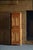A charming Danish two-part corner cabinet crafted in solid pine during the early 19th century. The cabinet displays...