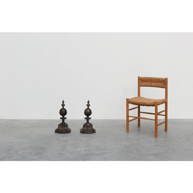 United Kingdom / 1950 / 2 firedogs / metal / Charles II Set of two turned solid brass and wrought iron baluster shaped...