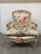 Design Plus Gallery presents a Bergere Chair with Gilt Accents + Floral with Aviary Upholstery. The chair is of a classic...