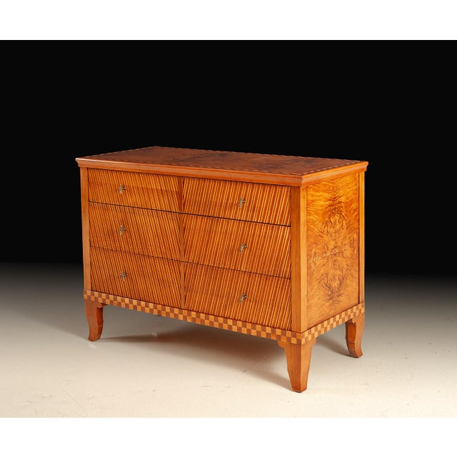 Handcrafted in Italy, this six-drawer chest showcases beautiful book-matched burl veneers and decorative wood inlays that...