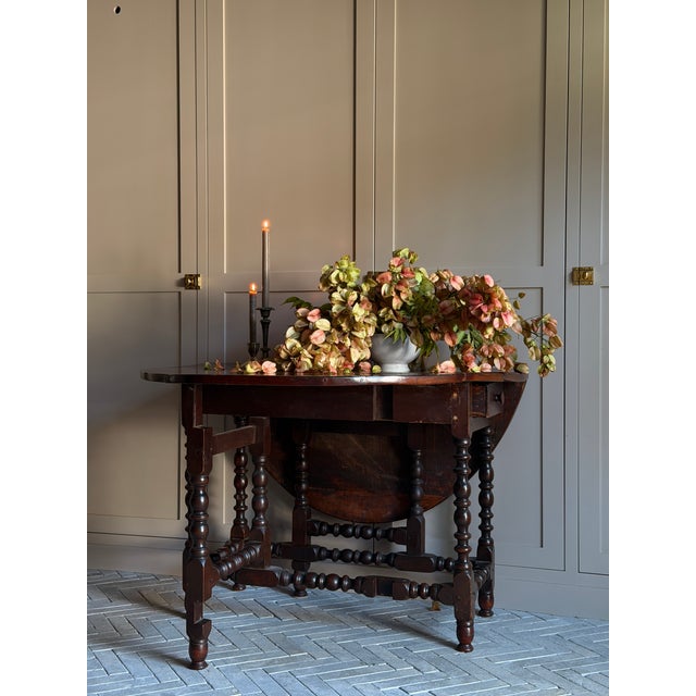 Beautiful vintage/antique-style wooden table with a rich, dark walnut-brown finish and lots of character. The table...