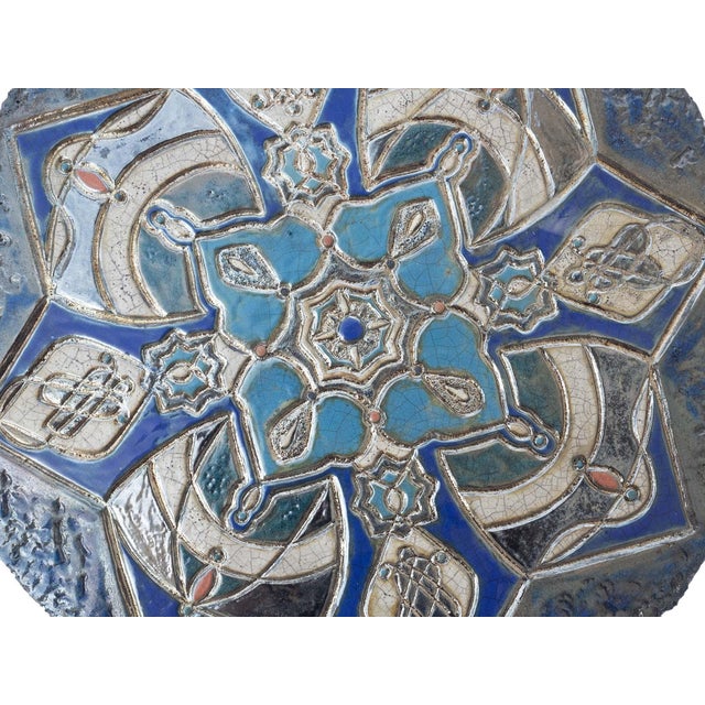 "L'Incanto" is a unique Raku ceramic wall artwork, entirely hand-molded and decorated by artist Stefania Zoppellaro. The...
