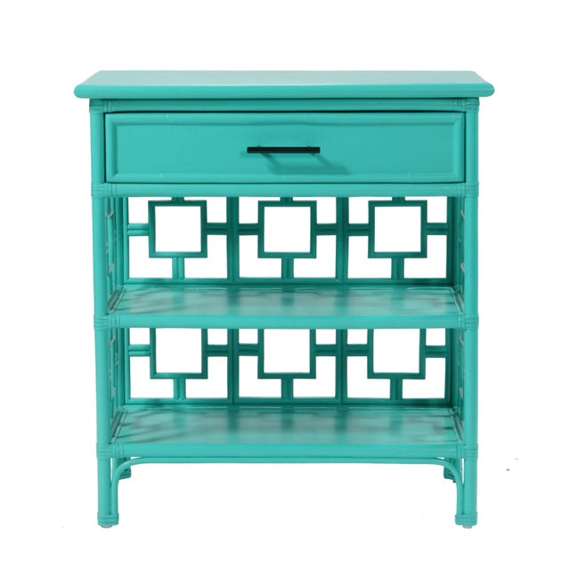 Classically styled, this end table features a Rattan frame with rawhide bindings. The intricate rattan detail is hand...