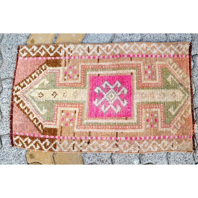 This is a vintage Turkish Oushak rug from the 1960s. The piece was hand-knotted.