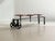 An exceptional industrial bench by kare design, featuring a striking combination of black lacquered steel, cast iron...