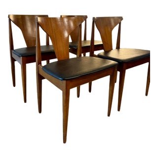 A Beautiful Set of 4 Mid Century Modern Dining Chairs in Teak With Black Faux Leather Seats, Attributed to Elliots of Newbury, Circa 1960s For Sale