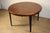 Elegant Scandinavian rosewood dining table by V.V. Møbler. Its gently curved top showcases the wood's beautiful, warm, and...