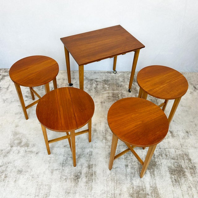 Set of five teak nesting tables designed by Poul Hundevad for Novy Domov, 1960s. Configuration includes one rectangular...