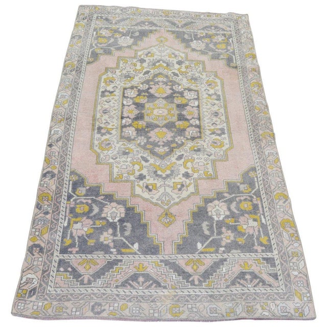 Vintage Turkish Anatolian hand knotted wool rug with natural colors.