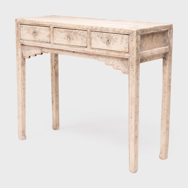 This clean-lined Chinese table dates to the turn of the century and was likely used as a small offering table for burning...