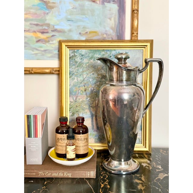 This vintage Wallace silver plate cocktail shaker holds an impressive 64 ounces, making it ideal for entertaining. With...