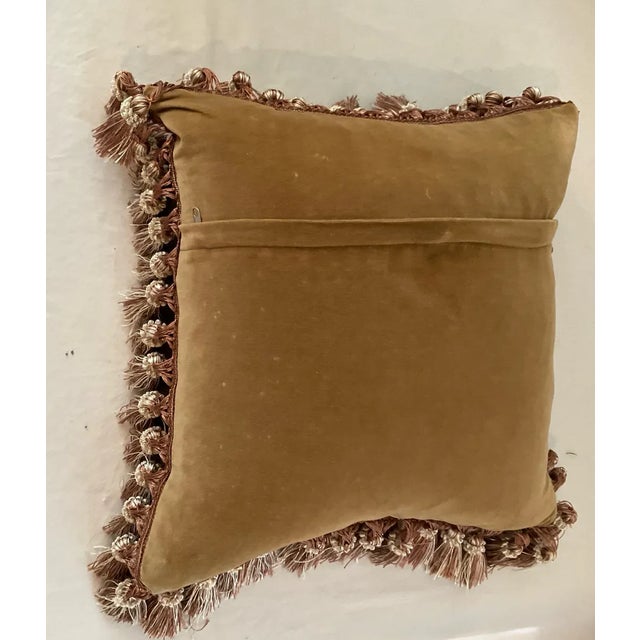 Gorgeous needlepoint pillow depicting a basket of pansies. Mocha velvet backing and tassel trip. Pillow case has zipper to...