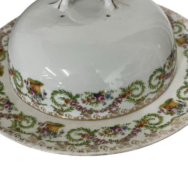 Antique, circa 1883-1914, Imperial China covered cheese / butter dish. Vines and floral border in pink and green surrounds...