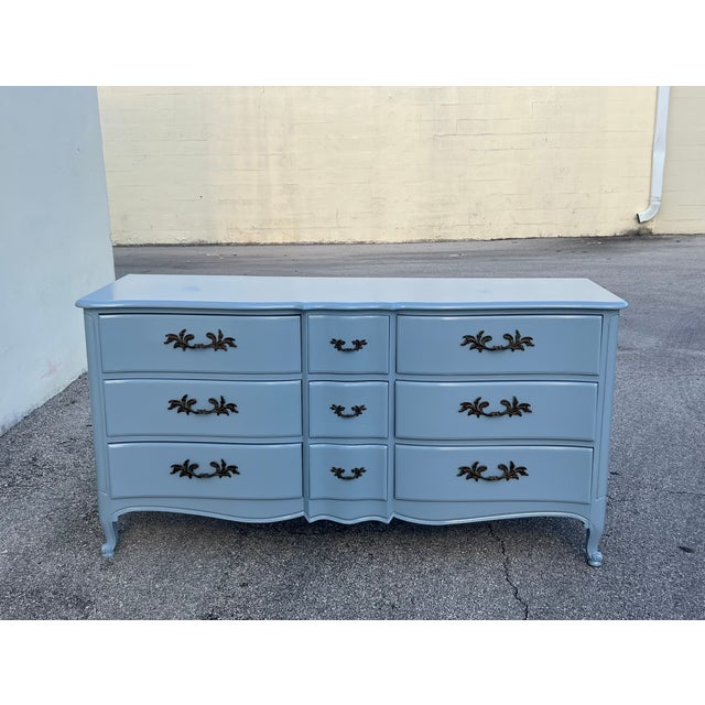 This is a solid built French provincial dresser with dovetail joints This dresser is newly lacquered in high gloss blue...