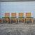 This is a wonderful set of four cane rattan dining chairs stamped Bielecky Brothers. The dining chairs feature solid wood...