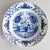 A pair of remarkably well preserved 18th century Delft chinoiserie plates featuring charming figures framed by trees,...