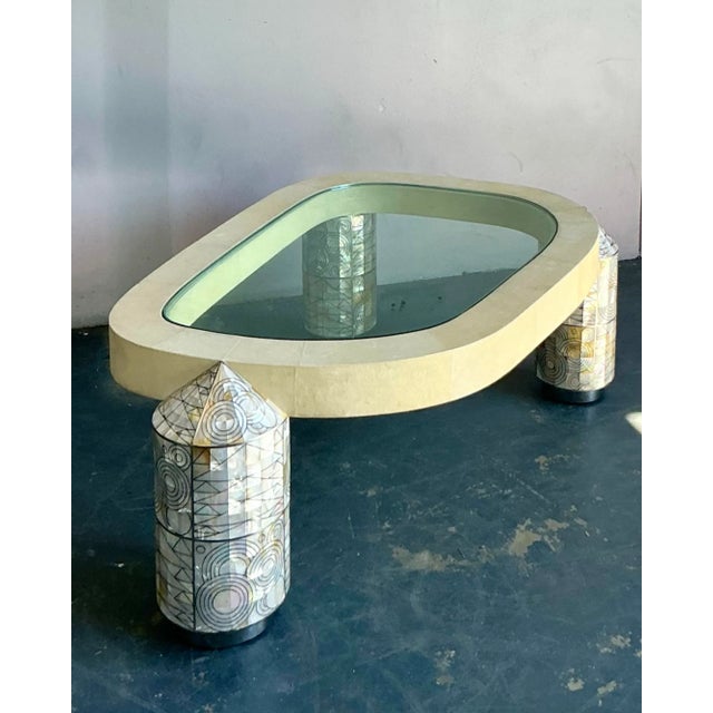 Presenting a magnificent vintage coffee table, inspired by the iconic designs of Ron Seff, featuring exquisite mother of...