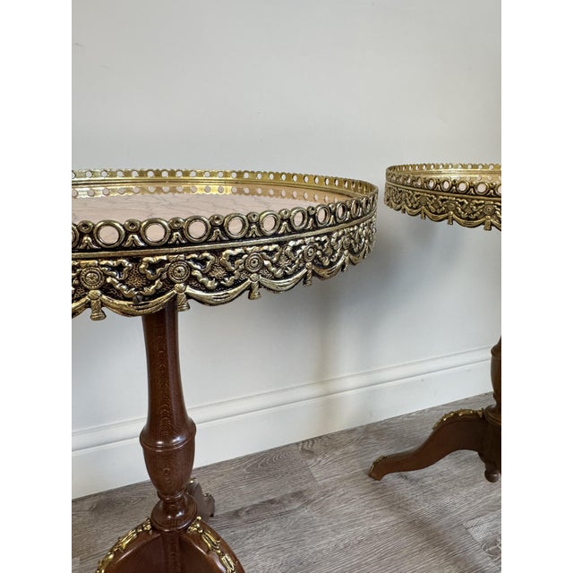 Pair of vintage French Louis XV style pink marble topped tripod side tables with gold coloured gallery detail. These were...