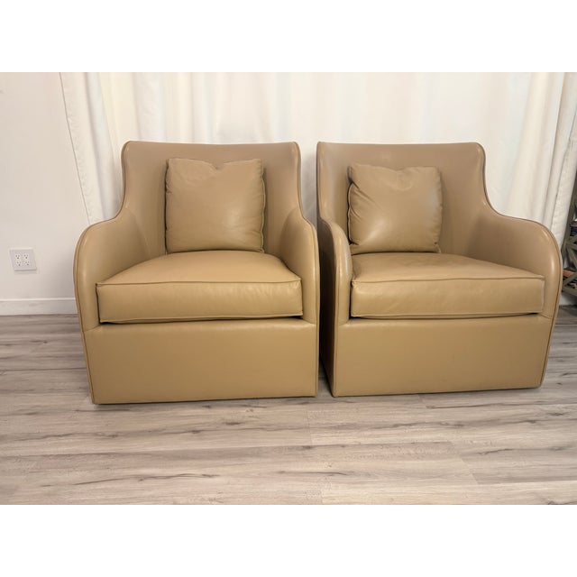 A custom made pair of Gregorius Pineo lounge chairs upholstered in genuine warm tan leather Their sculptural silhouettes...