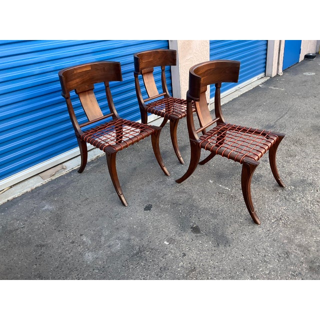 Klismos modern walnut chairs, set of 3. Chairs are made of solid walnut and have a natural walnut finish. Chairs are in...